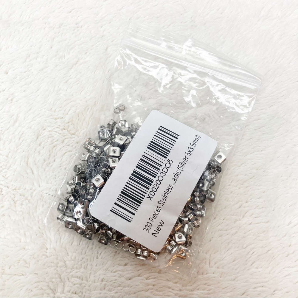 Pack of earring backs 300 pieces silver tone